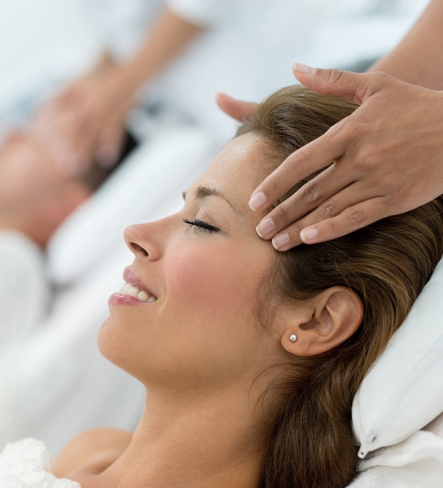 Woman receiving a relaxing head massage.