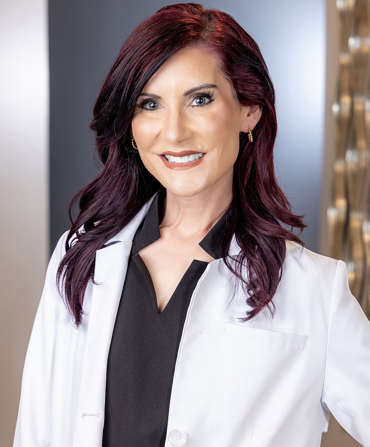 Smiling professional in a lab coat.