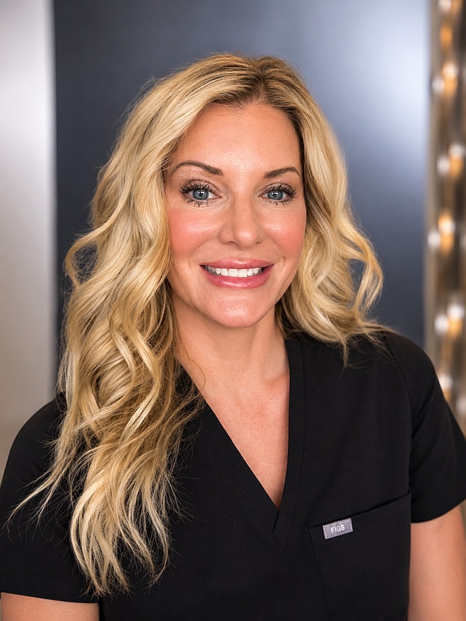 Smiling medical professional in black scrubs