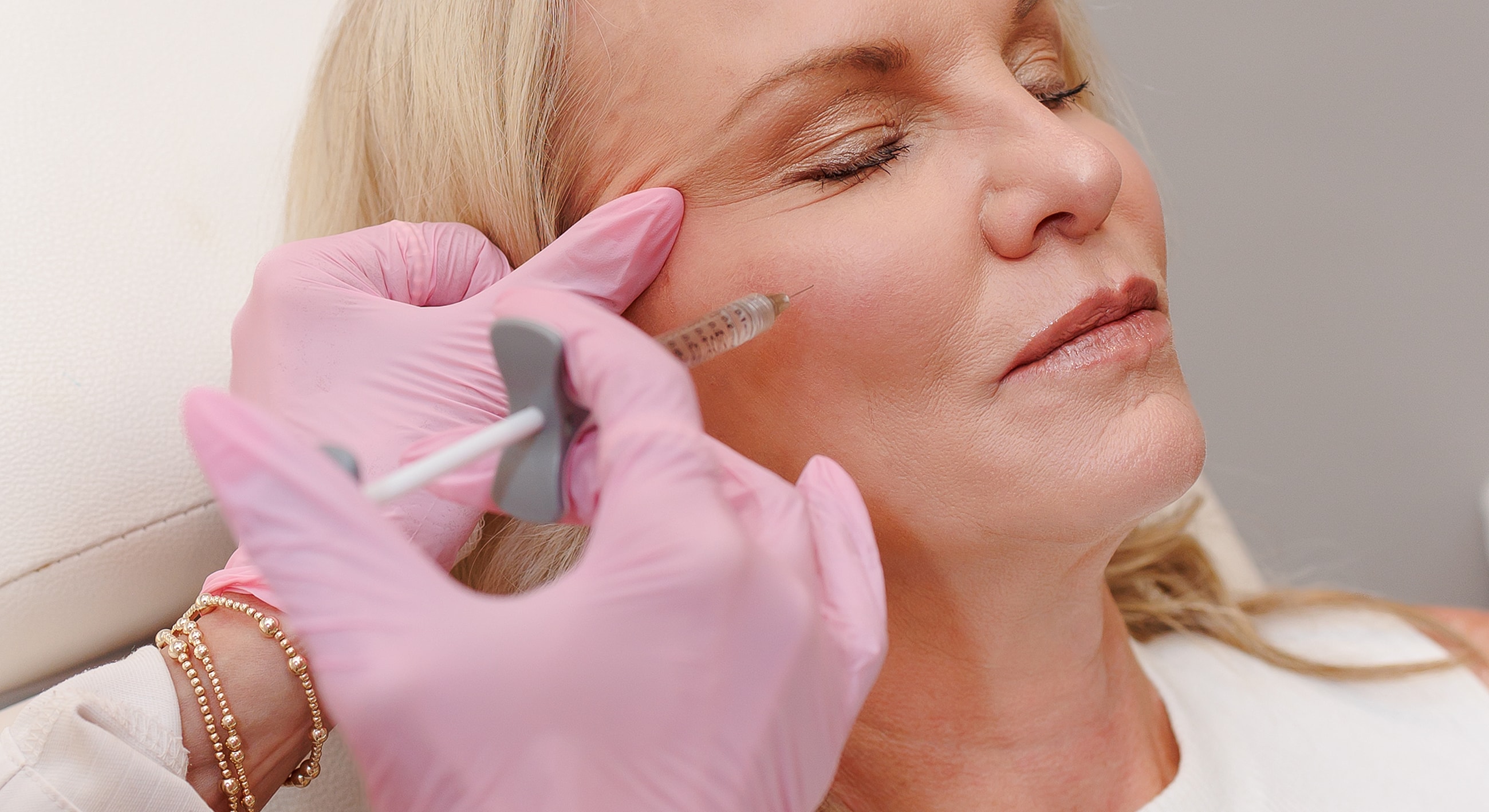 Cosmetic procedure with injection and patient relaxation.