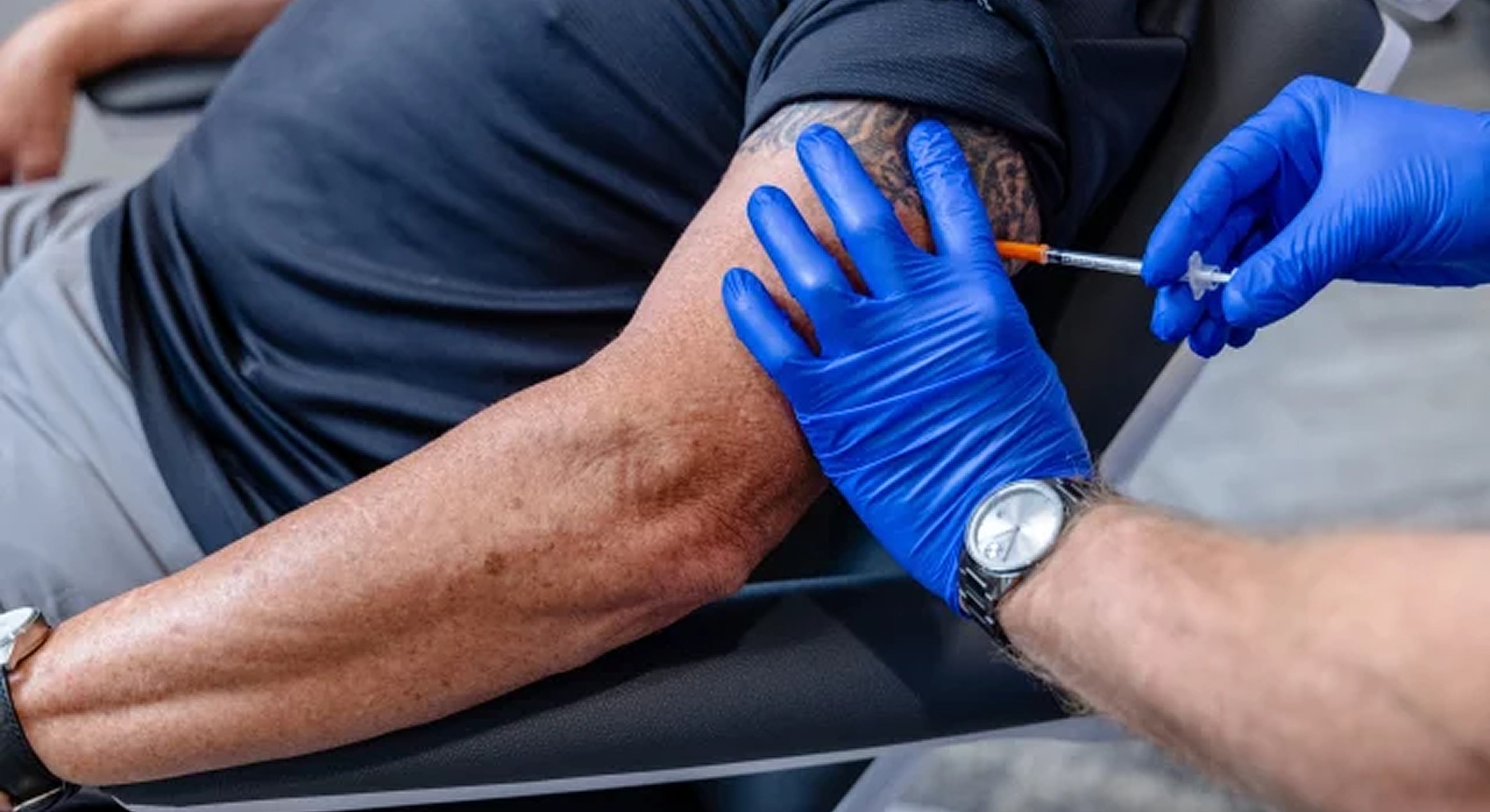 Vaccination in progress on a person's arm.